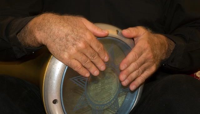 Joe playing the doumbek, a Middle Eastern drum