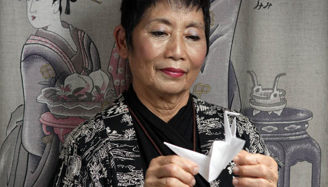 Mieko with an origami crane