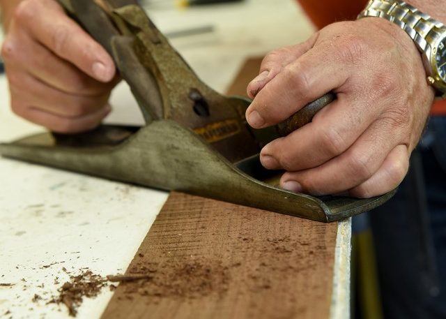 A smoothing plane is used to shave down pieces of wood