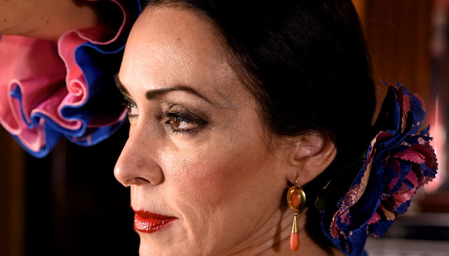 Coral earrings and a flower are typical accessories of the flamenco costume