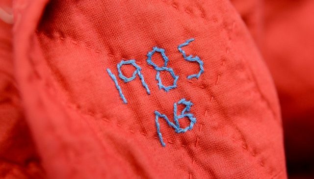 Nancy embroidered her initials and the year when she finished this traditional quilt