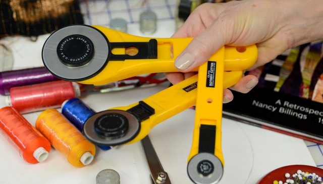 Nancy uses a variety of roller blades to cut fabric
