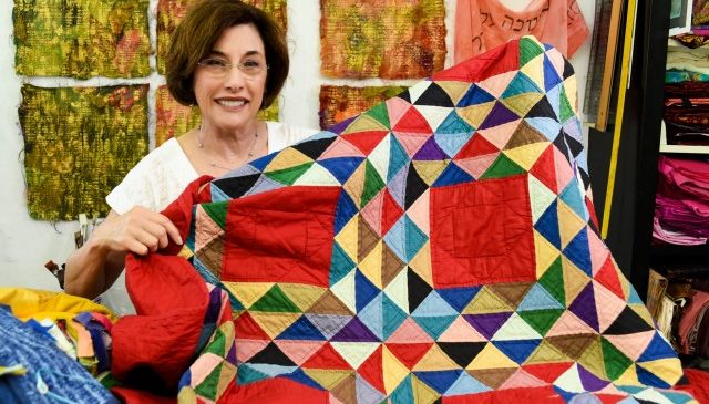 A traditional quilt piece featuring an Ocean Waves pattern