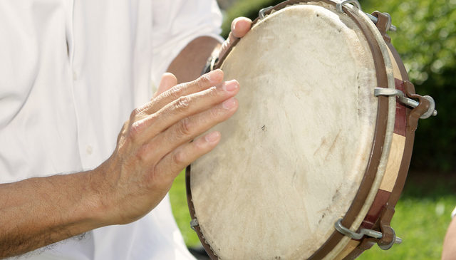 Playing the pandero drum